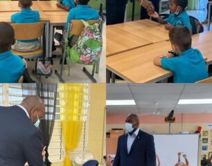 Minister-Ottley-distributes-water-and-apples-in-honor-of-World-Oral-Health-Day-to-the-students-of-Marie-Genevieve-DeWeever-.aspx_.jpg