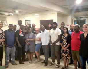 Hon. Minister of Justice Anna E. Richardson standing fourth from the left together with her support staff and heavy equipment operators (1)