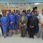 Honorable Minister of Justice Anna E. Richardson (standing center) together with Prison Director Mr. Carty CLIMB foundation instructors Point Blanche Prison and Hous