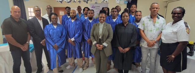 Honorable Minister of Justice Anna E. Richardson (standing center) together with Prison Director Mr. Carty CLIMB foundation instructors Point Blanche Prison and Hous