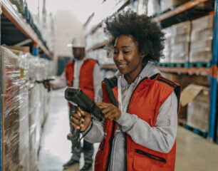 Young attractive woman working in the warehouse